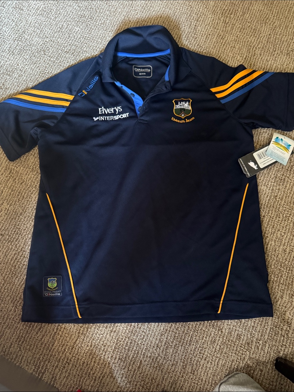 O'Neills Tipperary GAA polo shirt  Elverys Intersport sponsor logo